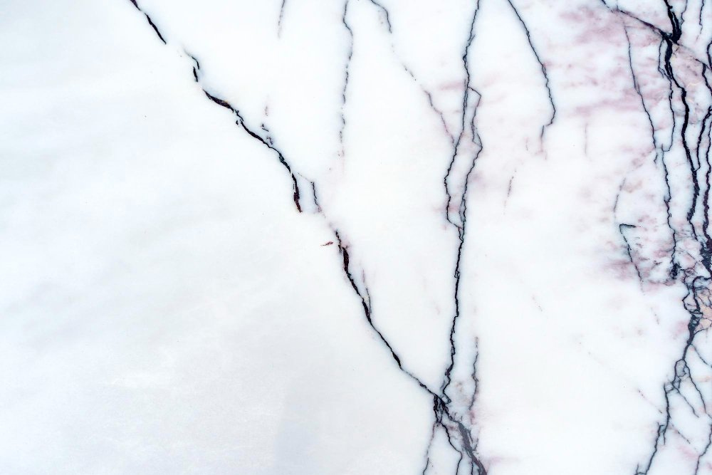 White Granite with Black Veins vs. White Quartz: Which Countertop Looks Better?
